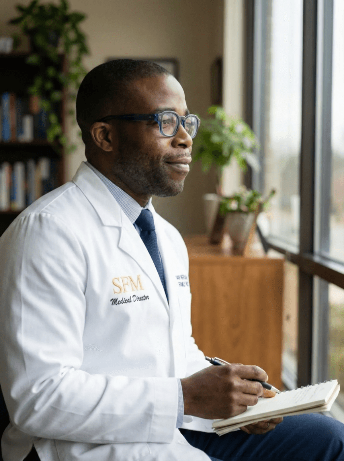Dr. Yaw Nkrumah in a contemplative moment at Sankofa Family Medicine